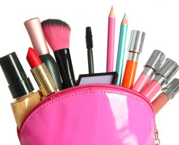 Beautiful make up bag with cosmetics , isolated on white